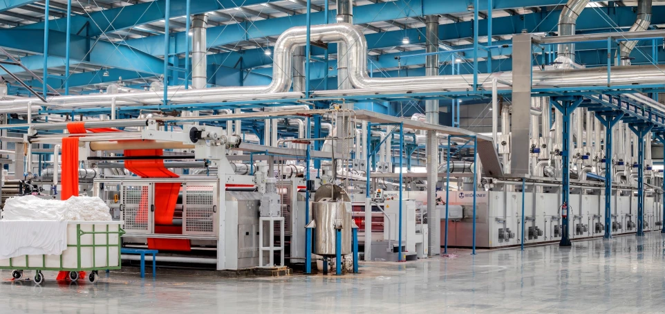 industrial textile factory with machinery and pipes